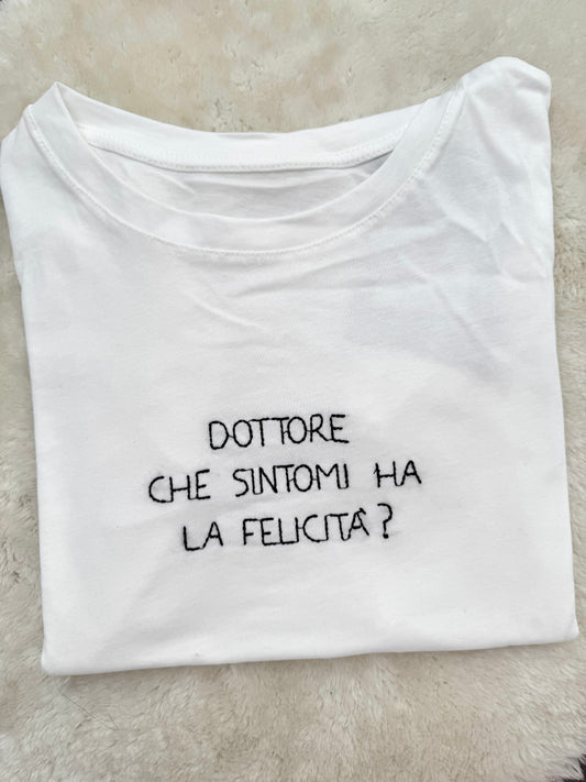 T-Shirt “Dottore che sintomi ha la felicità?”